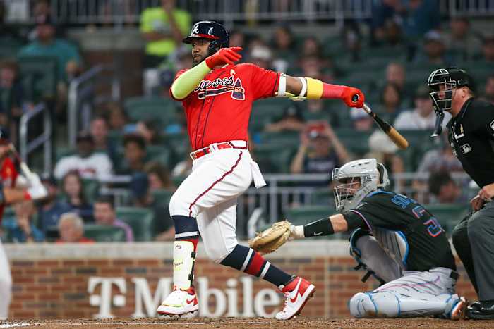 Sep 2, 2022; Atlanta, Georgia, USA; Atlanta Braves left fielder Marcell Ozuna (20) hits a single against the Miami Marlins in the fourth inning at Truist Park. Mandatory Credit: Brett Davis-USA TODAY Sports